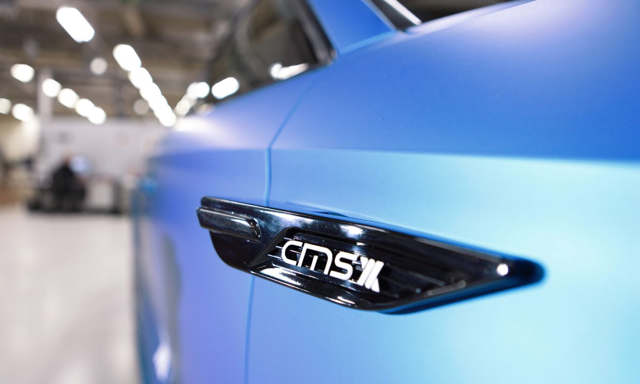 Automotive camera mirror system prototype detail on a blue vehicle