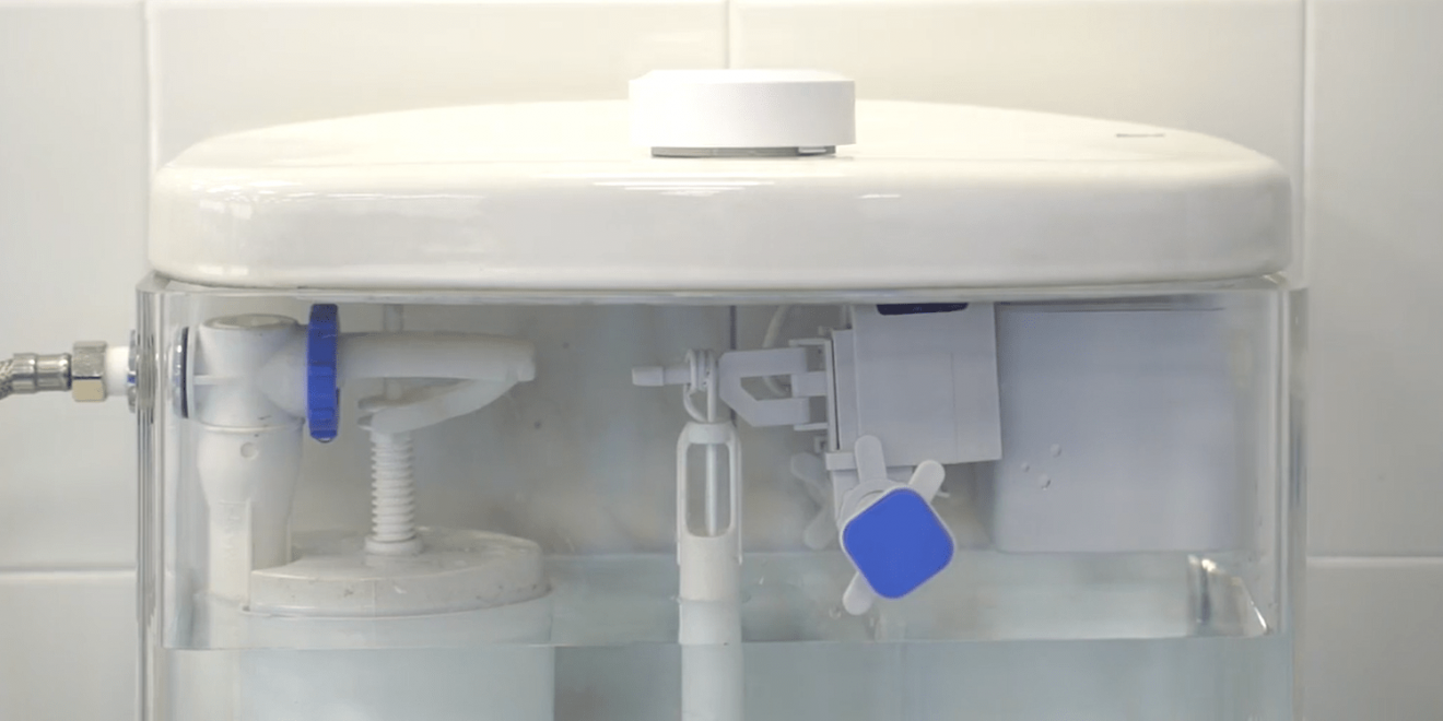 Touchless toilet flush prototype installed inside a toilet tank